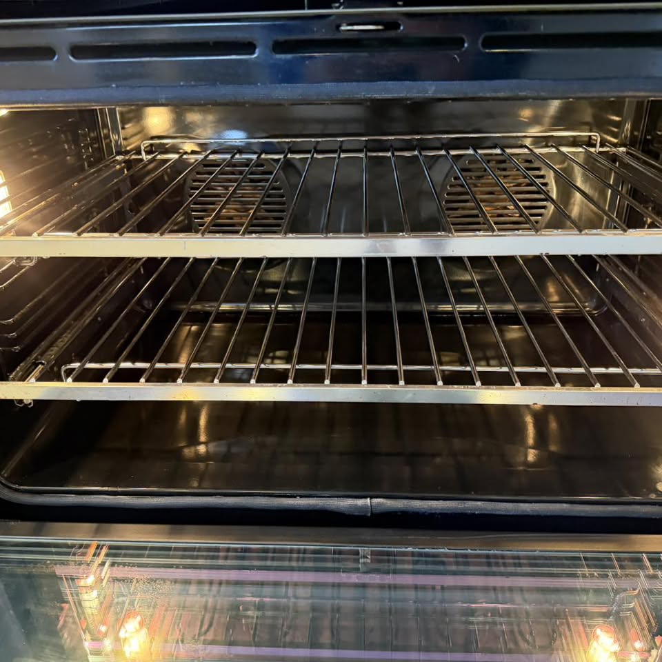 A spotless oven interior with gleaming clean racks — a separate labelled example