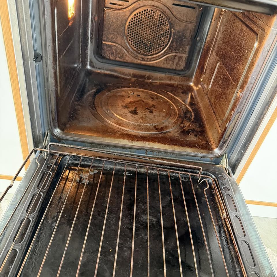 A severely burnt oven interior with charred racks — one labelled example